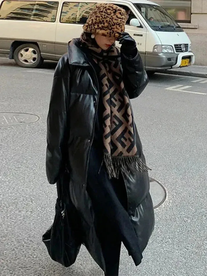 Long belted leather puffer jacket by Aimee