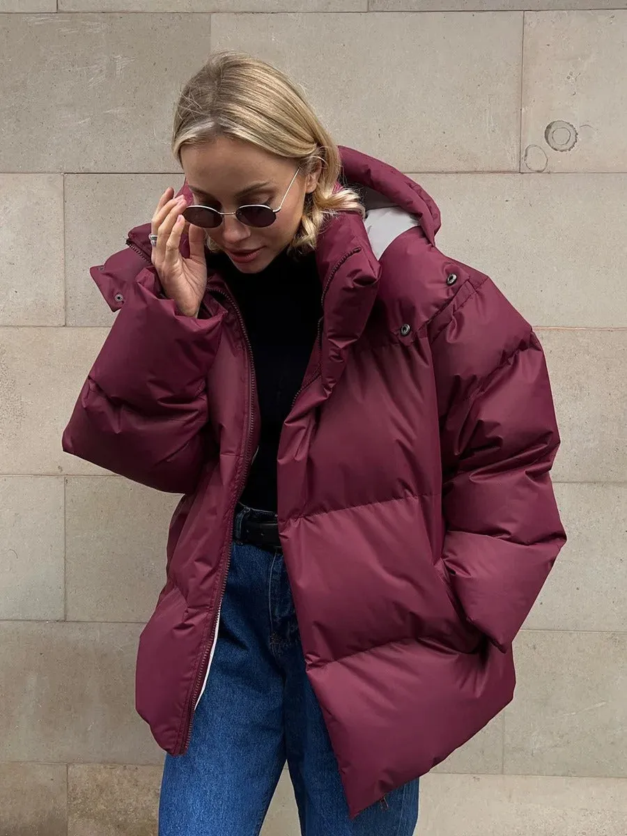 Short, warm, hooded women's quilted down jacket
