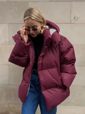 Short, warm, hooded women's quilted down jacket